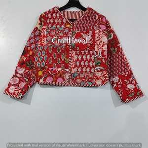 May include: Red quilted jacket with a floral print and a button closure. The jacket has a patchwork design and is made of cotton.