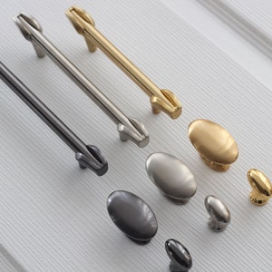 May include: A set of cabinet hardware in three finishes: black, nickel, and gold. The set includes both pulls and knobs.