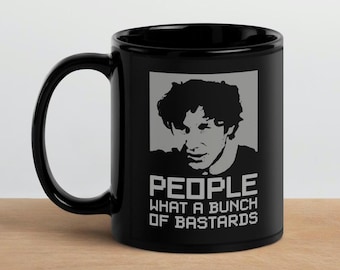 Taza de IT Crowd – «¡Qué panda de cabrones!» – Regalo friki