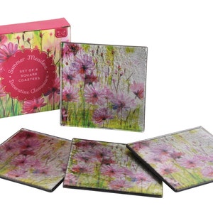 May include: Set of four square glass coasters with a floral design featuring pink flowers on a green background. The coasters come in a box with the text "Summer Meadows Set of 4 Square Coasters Decorative Glassware".
