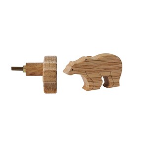 May include: Wooden bear-shaped knob with a hexagonal base and a screw for attaching to a drawer or door. The knob is made of light brown wood and has a simple, rustic design.