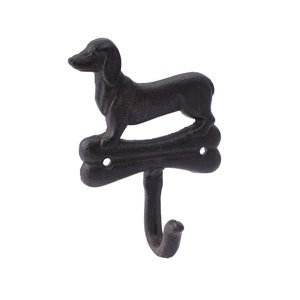 May include: Black cast iron dachshund dog hook with a bone design. The hook is shaped like a bone and the dachshund is standing on top of it.