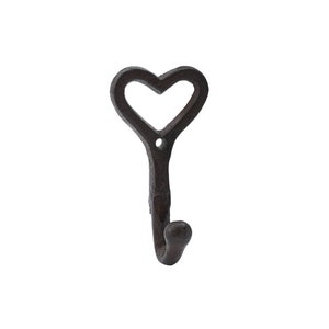 May include: A black cast iron heart-shaped hook. The hook is designed to hang items on a wall.