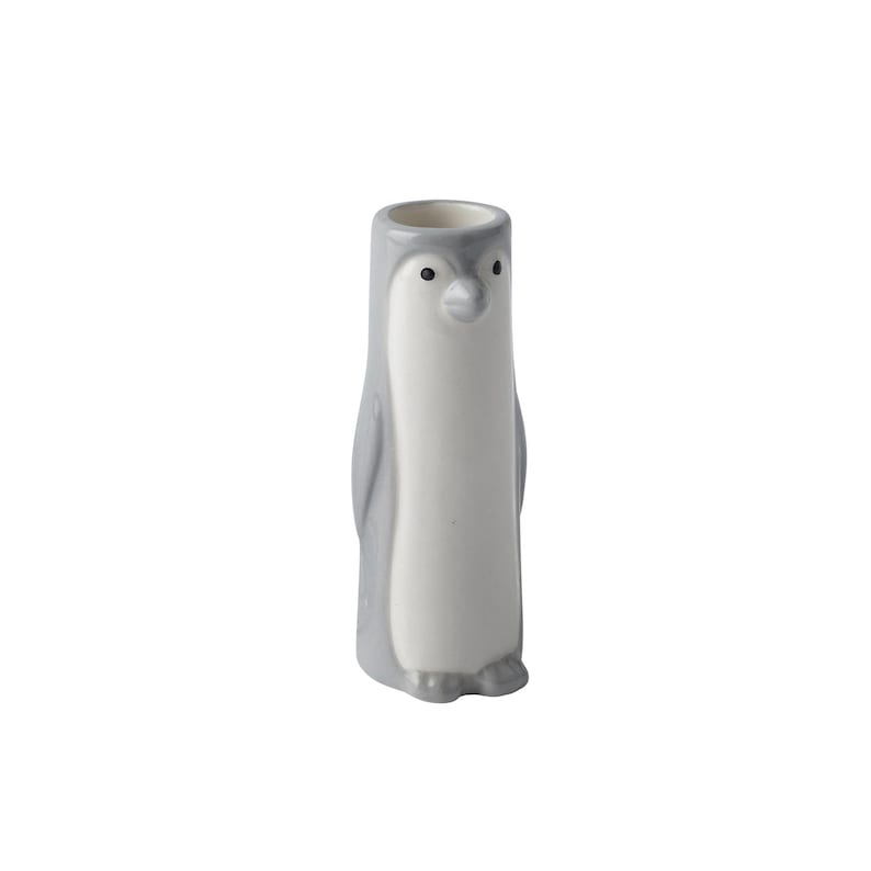 May include: A grey and white ceramic penguin vase. The penguin has a black beak and eyes.