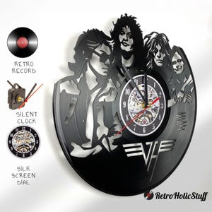 May include: Black vinyl record clock featuring a silhouette of the band Van Halen. The clock face is a clear, circular dial with a silver and black clock mechanism. The band's logo is visible in the lower right corner of the record.