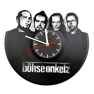 Straight-on photo of Böhse Onkelz vinyl wall clock with band silhouette and band name cut into the lower section of the record.