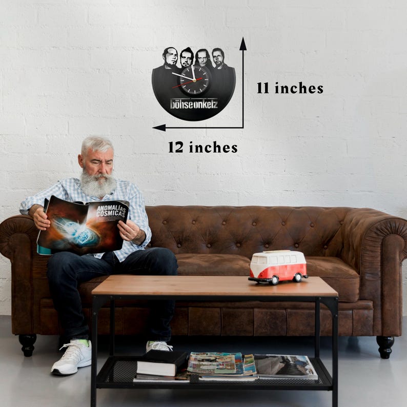Böhse Onkelz vinyl record clock displayed above a couch with measurements showing 12 inches wide and 11 inches tall.