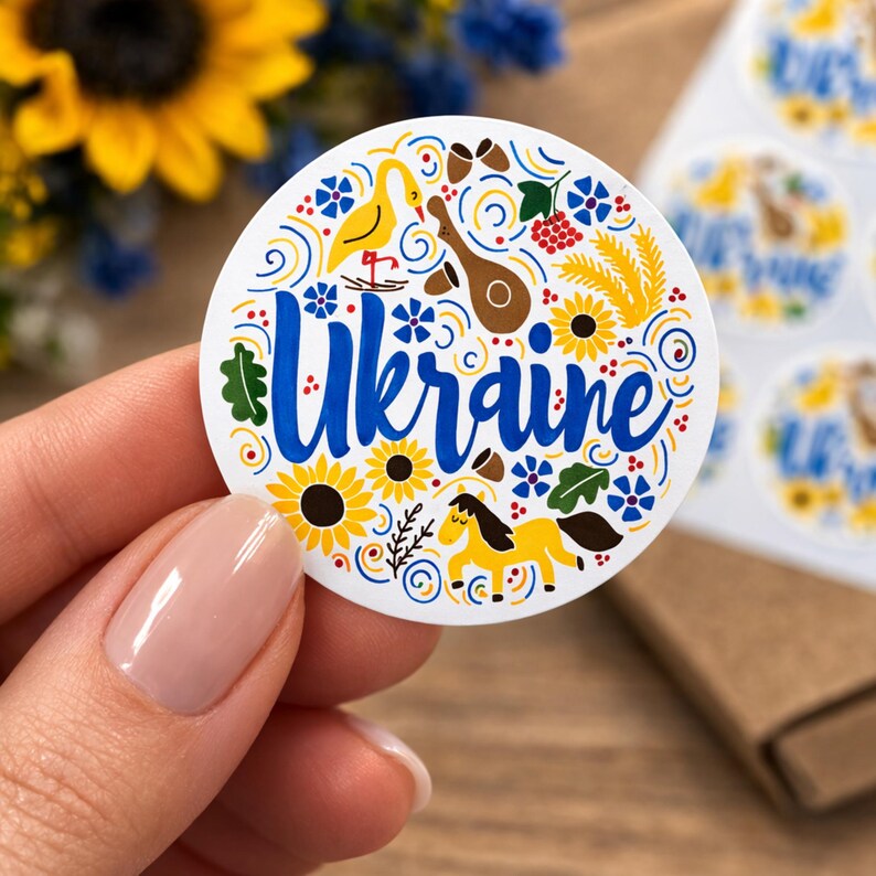 Digital Ukraine wall art in a modern folk-inspired style. A blue-and-yellow printable featuring sunflower, bird, wheat, and ornamental motifs for meaningful home decor or gifting.