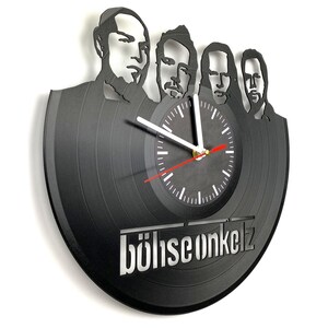 Vinyl record wall clock featuring Böhse Onkelz band silhouette and minimalist clock face with white and red hands.