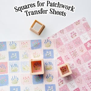 May include: The image shows squares for patchwork transfer sheets. The image features three small, square-shaped tools and two sheets of patterned paper. The paper has floral designs in pink, blue, and white. The text "Squares for Patchwork Transfer Sheets" is at the top.