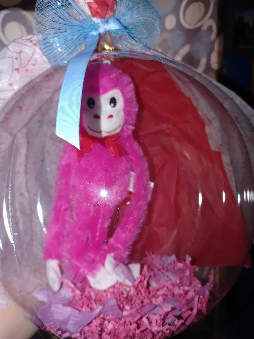 Light up Bobo stuffed animal balloons with decorations. Great Etsy