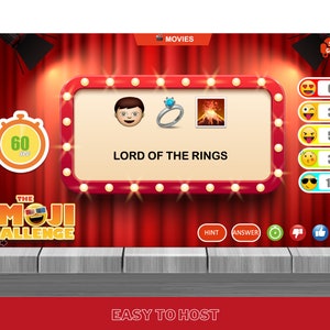 May include: A red and white game board with a timer, emojis, and the text "The Emoji Challenge". The game board is set up for a game about movies. The game board shows the movie "Lord of the Rings" with three emojis: a man, a ring, and a volcano.