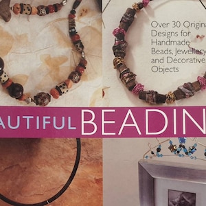 May include: A book cover with the title "BEAUTIFUL BEADING" in pink lettering. The cover features three images of beaded jewellery, including a necklace with brown, orange, and white beads, a necklace with brown, gold, and pink beads, and a silver frame with a beaded design.