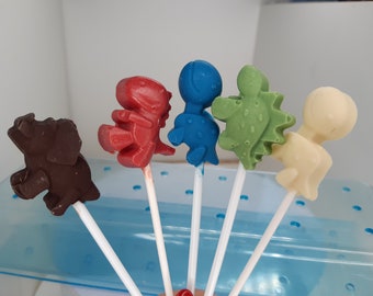 Feestgunsten/taarttoppers/muffintoppers voor kinderen, handgemaakte dinosauruslolly&#39;s van chocolade