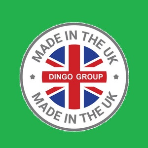 May include: A white circle with a gray border and the text "MADE IN THE UK" around the edge. Inside the circle is a red, white, and blue Union Jack flag with the text "DINGO GROUP" in a red banner across the middle.