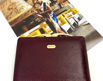 Vintage ladies OROTON pebbled leather in burgundy with gold frame - comes with dust bag - c1980s-90s - slimline and elegant