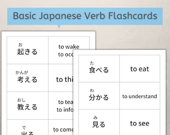 May include: Black and white flashcards with Japanese verbs and their English translations. The Japanese verbs are written in hiragana and the English translations are written in black text.
