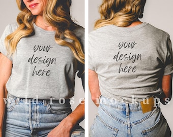 May include: A heather grey t-shirt with short sleeves and a crew neck. The shirt has the text "your design here" written on the front and back.
