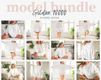 May include: A set of 12 model mockups featuring a white Gildan 18000 sweatshirt. The models are wearing the sweatshirt in various poses and settings, including sitting on a bed, standing in a room, and sitting on a chair.