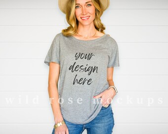 May include: A gray t-shirt with a relaxed fit and short sleeves. The shirt has the text "your design here" printed on the front.