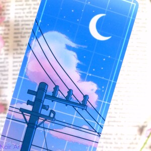 May include: A blue and pink aesthetic illustration of a power line pole with a crescent moon and stars in the sky. The background is a grid pattern.