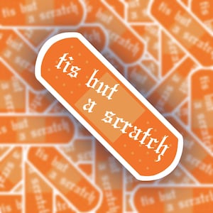 May include: Orange band-aid sticker with the text "tis but a scratch" in a gothic font.