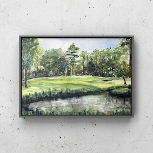 May include: A watercolor painting of a golf course with a pond in the foreground. The painting features a green golf course with trees lining the edges. The pond is a light blue color with reflections of the trees and sky.