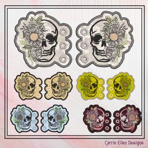 Puede incluir: Conjunto de seis diseños de calaveras bordadas con detalles florales. Las calaveras son de varios colores, incluyendo gris, amarillo, azul y rojo. Los detalles florales son en tonos de blanco y verde. Los diseños son perfectos para añadir un toque de fantasía a cualquier proyecto.