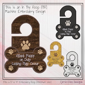 May include: Machine embroidery design featuring a door hanger in the shape of a bone with paw prints. The text reads "Attack Puppy on Duty, Licking May Occur." The design is available in brown, black, gold, and gray.