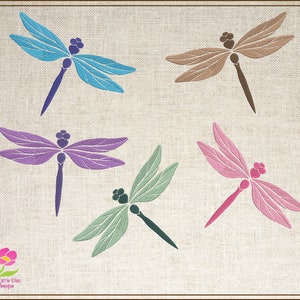 May include: Five colorful dragonfly designs on a beige linen background. The dragonflies are in shades of blue, purple, brown, green, and pink.
