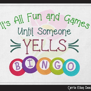 May include: It's all fun and games until someone yells "Bingo!"  Embroidered design with a pink flower and colourful bingo balls.