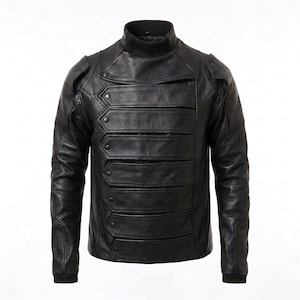 May include: A black leather jacket featuring a high collar and a front panel composed of horizontal, overlapping straps secured with metal snaps. The sleeves have structured shoulder detailing and ribbed cuffs, creating a layered appearance.