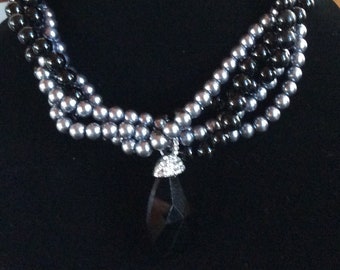 Multi strand Black and Gray faux Pearls with a black pendant and Rhinestones necklace