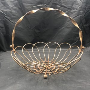 Vintage Metal Basket with Twisted Handle gold tone open design ball feet 9&quot; high