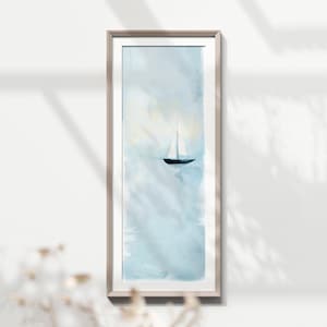 May include: A framed watercolor painting of a sailboat on a light blue sea with a white sky. The sailboat is in the center of the image and is facing the right side of the image.