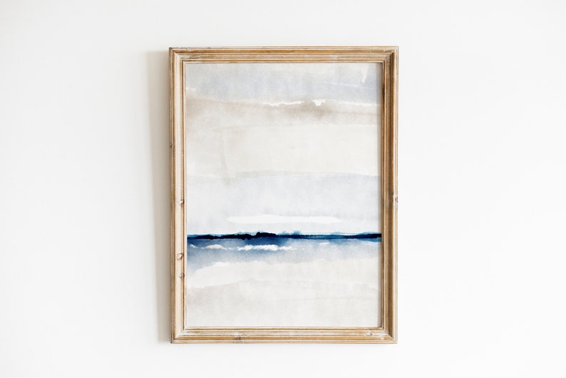 May include: A framed abstract watercolor painting with a light blue and gray color scheme. The painting features horizontal lines and a subtle texture.
