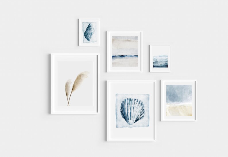 May include: A set of six framed watercolor prints featuring seashells, feathers, and abstract ocean scenes in shades of blue, white, and beige.