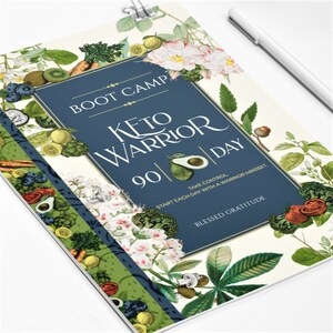 May include: A blue and green journal cover with a floral design and the text "BOOT CAMP KETO WARRIOR 90 DAY TAKE CONTROL. START EACH DAY WITH A WARRIOR MINDSET. BLESSED GRATITUDE"