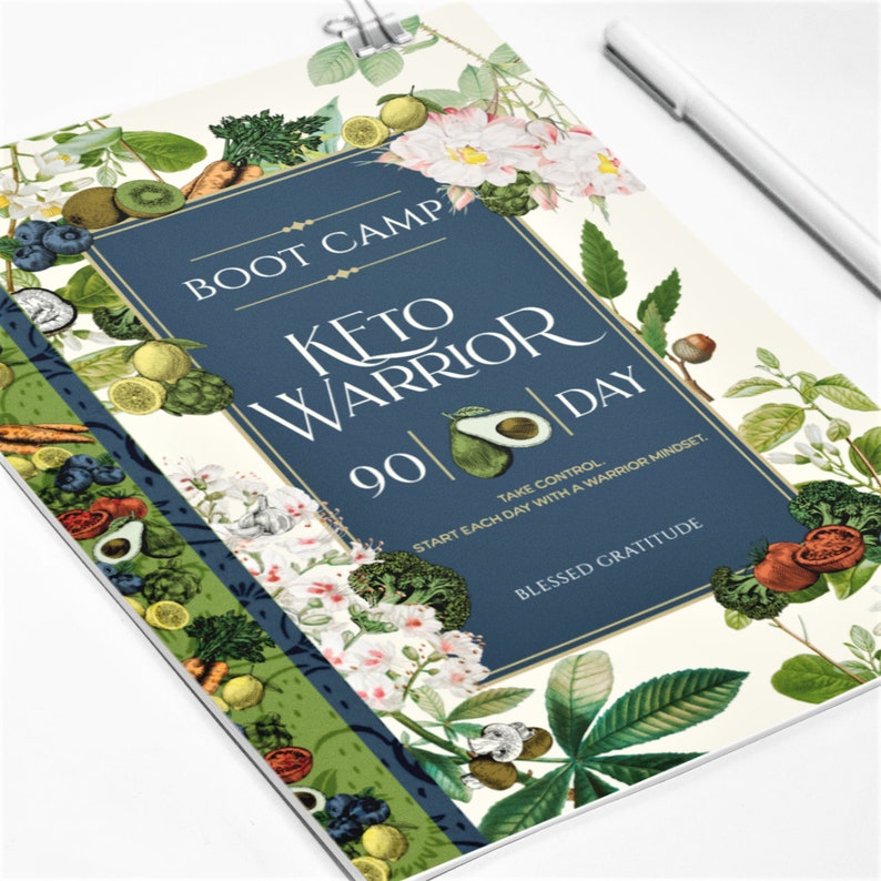 May include: A blue and green journal cover with a floral design and the text "BOOT CAMP KETO WARRIOR 90 DAY TAKE CONTROL. START EACH DAY WITH A WARRIOR MINDSET. BLESSED GRATITUDE"
