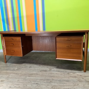 Mid Century Teak Executive Desk Designed by Arne Vodder, a prominent Danish designer, and manufactured by Sibast Møbelfabrik in Denmark