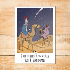 May include: A humorous cartoon shows three wise men on camels, with a shooting star in the night sky. The text reads, "Is it a bird? Is it a plane? No, it's Superman!" A festive and comical design.