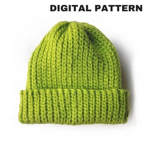 Peut inclure: Un bonnet en tricot vert vif avec une texture côtelée.