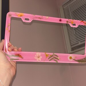 Pink glitter license plate frame.
