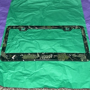 License plate frame with greenery
