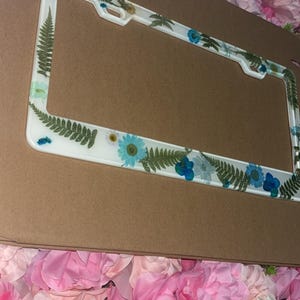 blue flower license plate frame