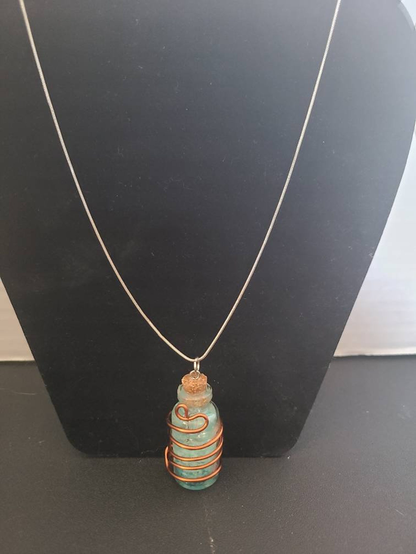 Glowing wire wrapped bottle necklace. Etsy