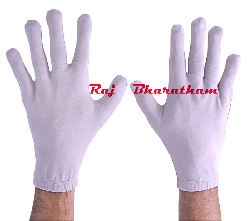 May include: A pair of white cotton gloves with a seamless design. The gloves are shown with the palms facing outward.