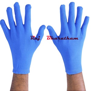 May include: A pair of bright blue cotton gloves. The gloves are seamless and have a close-fitting design.
