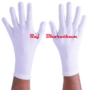 May include: A pair of white cotton gloves with the text "Raj Bharatha" printed on the back of the right glove.