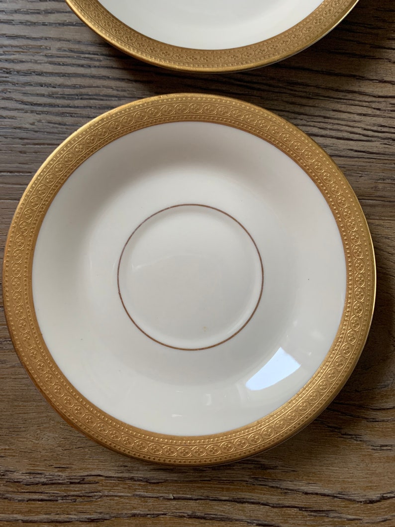 Set of 4 Old Ivory Syracuse China Bracelet Design Saucers